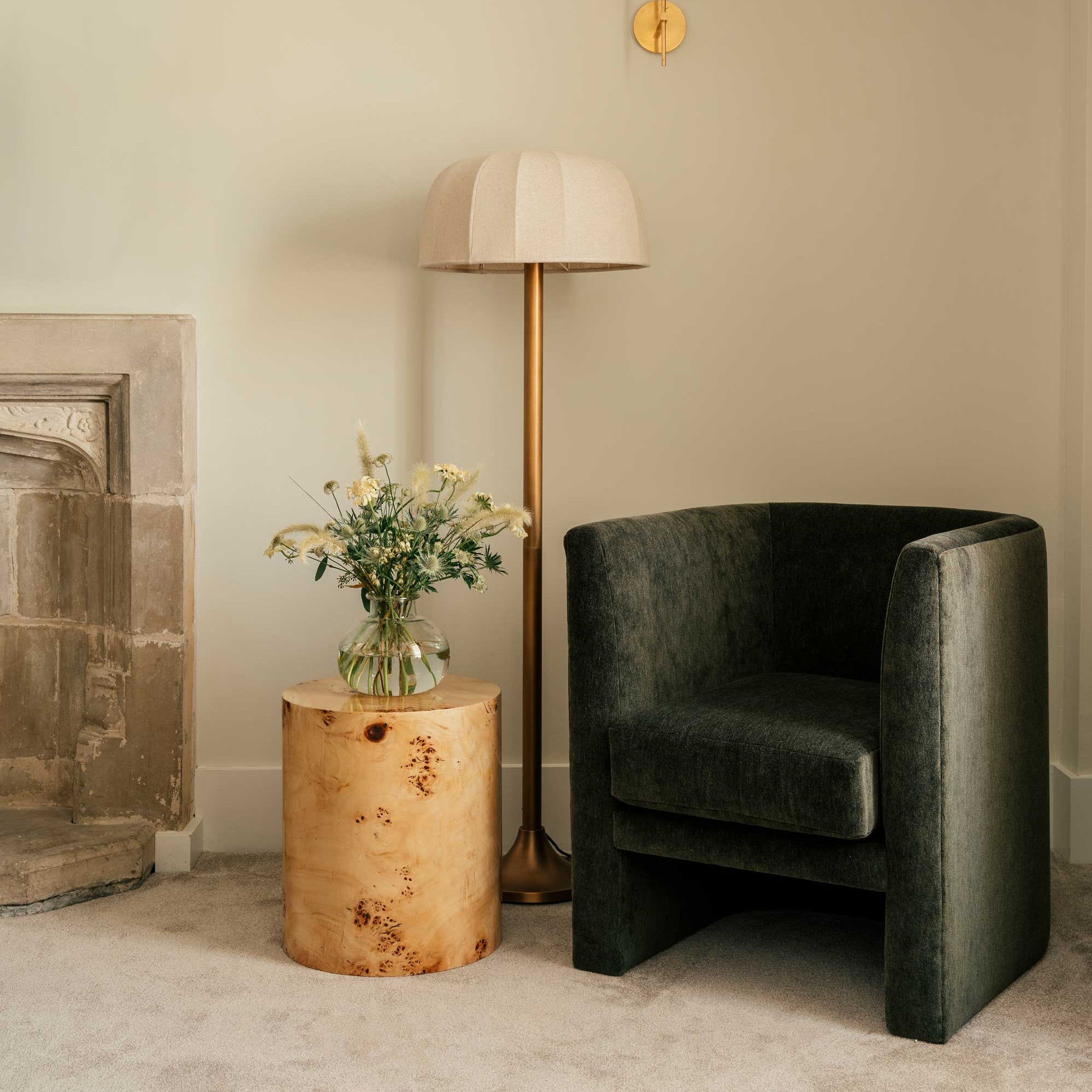 The Feather Hotel in Woodstock, green fabric armchair