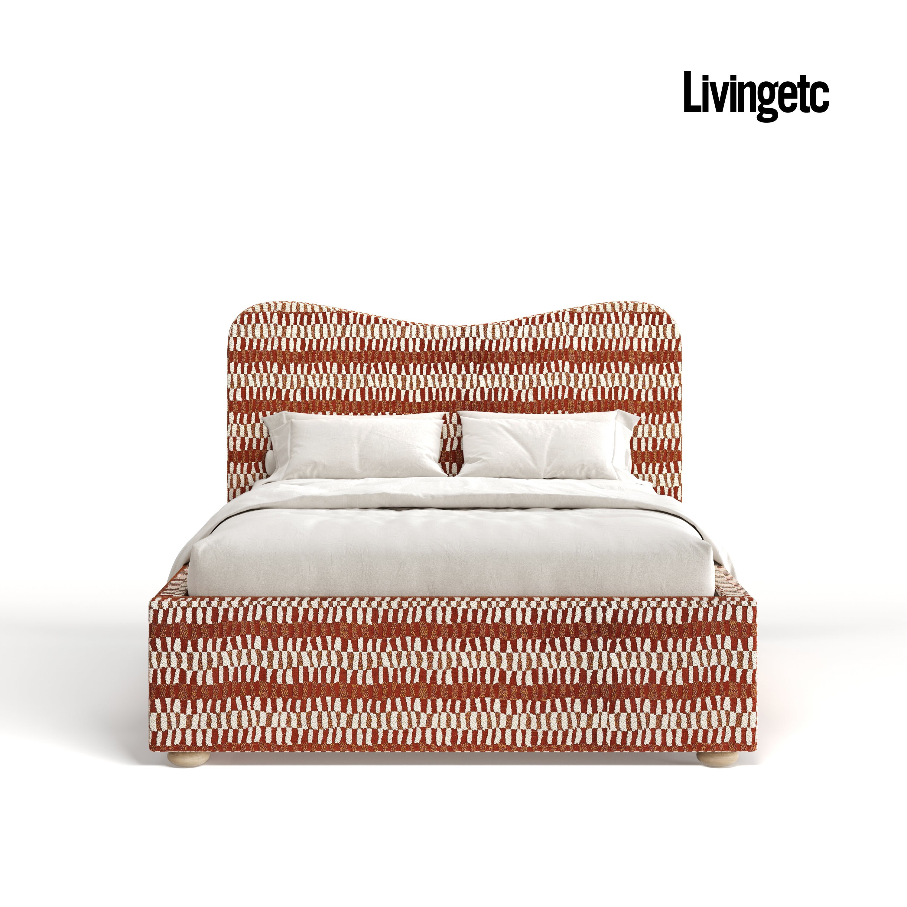 Bed with red and white patterned headboard and bedding on a white background